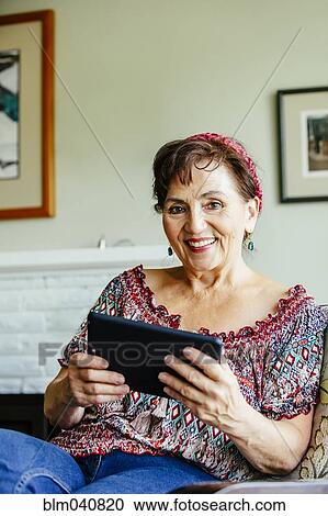 Caucasian woman using digital tablet View Large Photo Image Stock Image - Caucasian woman using digital tablet. Fotosearch
