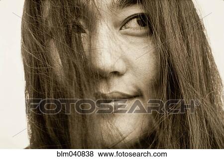 Stock Photo - Close up of smiling Japanese woman. Fotosearch