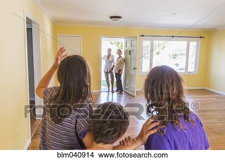 Family admiring new home View Large Photo Image Picture - Family admiring new home. Fotosearch