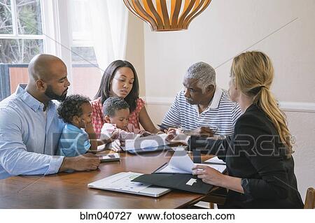 Financial advisor talking to clients View Large Photo Image Stock Photo - Financial advisor talking to clients. Fotosearch