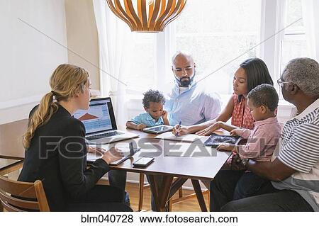 Financial advisor talking to clients View Large Photo Image Stock Photo - Financial advisor talking to clients. Fotosearch