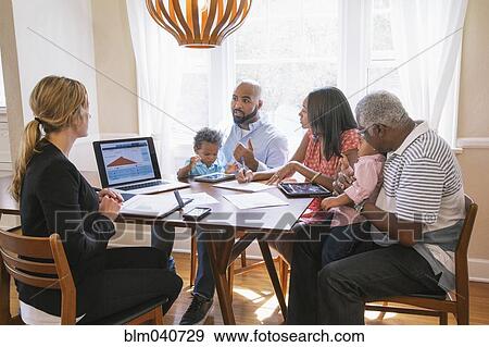 Financial advisor talking to clients View Large Photo Image Stock Photo - Financial advisor talking to clients. Fotosearch