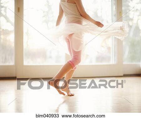 Girl twirling in skirt View Large Photo Image Stock Image - Girl twirling in skirt. Fotosearch