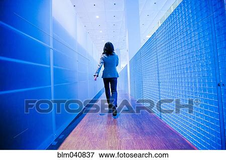 Japanese businesswoman walking in hallway View Large Photo Image Stock Photo - Japanese businesswoman walking in hallway. Fotosearch