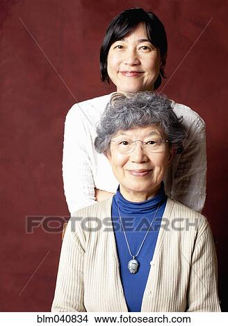 Japanese mother and daughter smiling View Large Photo Image Picture - Japanese mother and daughter smiling. Fotosearch