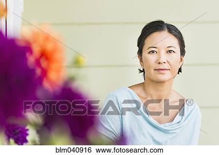 Stock Photograph - Serious woman outdoors. Fotosearch