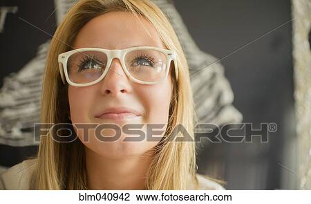 Stock Image - Woman wearing modern eyeglasses. Fotosearch