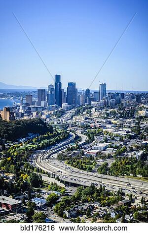 Stock Photograph - Aerial view of highway and Seattle cityscape, Washington, United States. Fotosearch