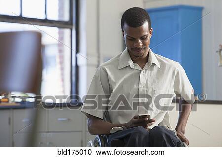 African American paraplegic man using cell phone View Large Photo Image Stock Image - African American paraplegic man using cell phone. Fotosearch