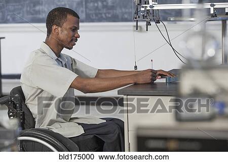 African American paraplegic student working in science classroom View Large Photo Image Stock Image - African American paraplegic student working in science classroom. Fotosearch