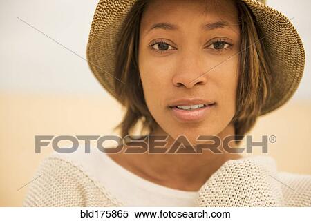 Stock Photography - African American woman at beach. Fotosearch