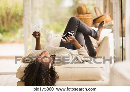 African American woman listening to earbuds View Large Photo Image Stock Image - African American woman listening to earbuds. Fotosearch