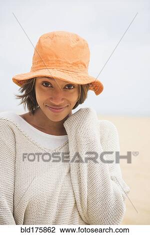African American woman wearing sun hat View Large Photo Image Stock Image - African American woman wearing sun hat. Fotosearch
