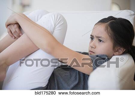 Angry girl sulking on sofa View Large Photo Image Stock Image - Angry girl sulking on sofa. Fotosearch