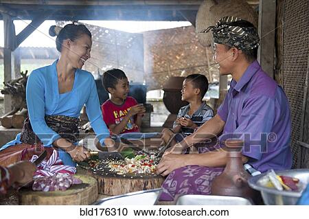 Asian family cooking together in outdoor kitchen View Large Photo Image Stock Image - Asian family cooking together in outdoor kitchen. Fotosearch