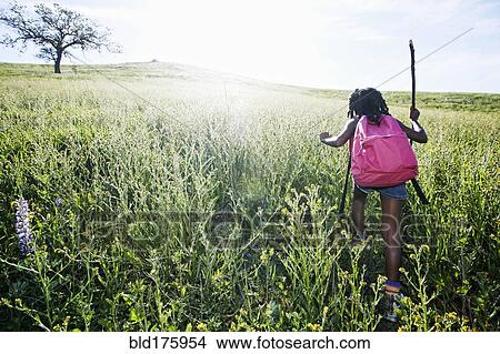 Black girl walking on rural hillside View Large Photo Image Picture - Black girl walking on rural hillside. Fotosearch