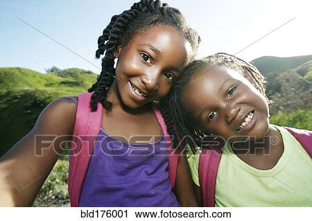 Black girls smiling outdoors View Large Photo Image Stock Image - Black girls smiling outdoors. Fotosearch