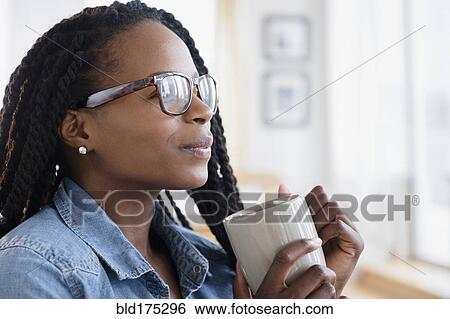 Black woman drinking cup of coffee View Large Photo Image Stock Photograph - Black woman drinking cup of coffee. Fotosearch