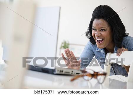 Black woman using laptop View Large Photo Image Stock Image - Black woman using laptop. Fotosearch