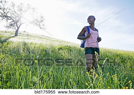 Black woman walking on rural hillside View Large Photo Image Stock Photography - Black woman walking on rural hillside. Fotosearch
