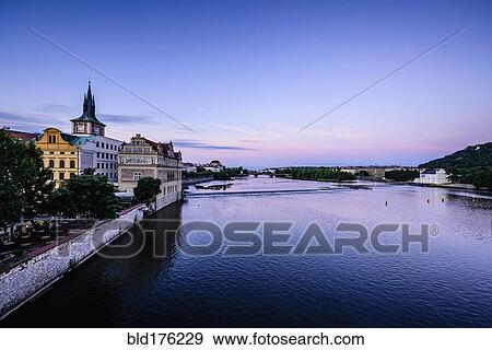 Blue sky over Prague waterfront, Czech Republic View Large Photo Image Stock Photo - Blue sky over Prague waterfront, Czech Republic. Fotosearch