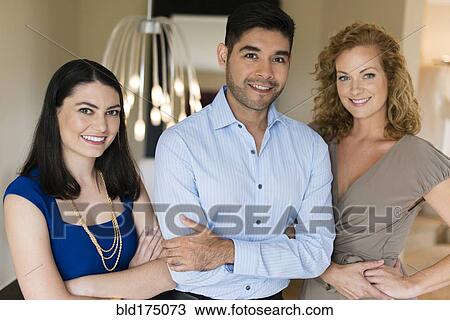 Business people smiling indoors View Large Photo Image Stock Image - Business people smiling indoors. Fotosearch