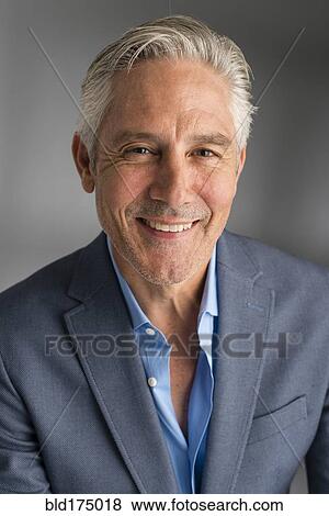 Caucasian businessman smiling View Large Photo Image Stock Photo - Caucasian businessman smiling. Fotosearch