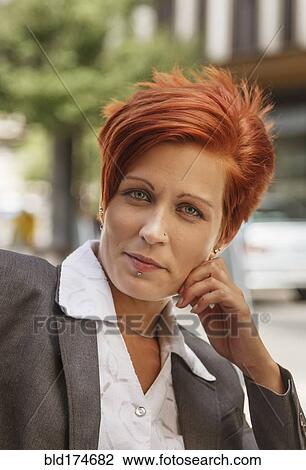 Stock Image - Caucasian businesswoman smiling. Fotosearch