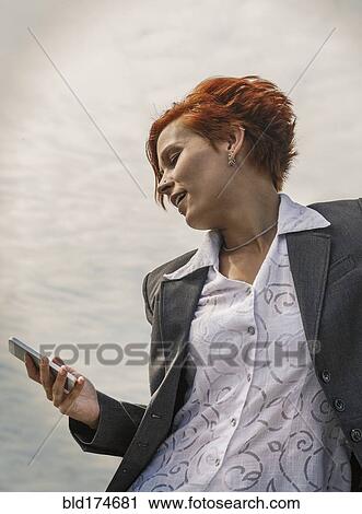 Caucasian businesswoman using cell phone View Large Photo Image Stock Image - Caucasian businesswoman using cell phone. Fotosearch