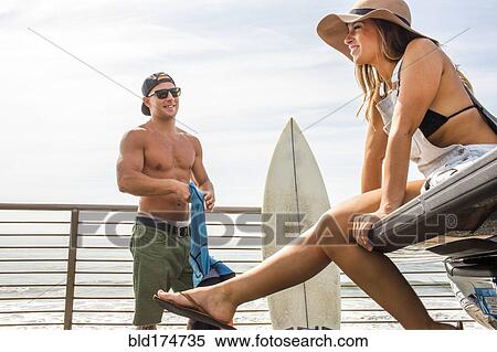 Caucasian couple talking at beach View Large Photo Image Stock Photography - Caucasian couple talking at beach. Fotosearch