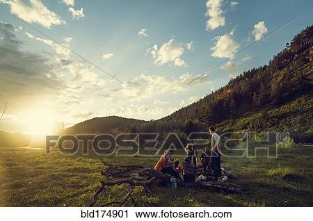 Caucasian friends in rural field View Large Photo Image Stock Image - Caucasian friends in rural field. Fotosearch