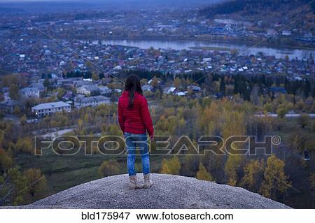 Stock Photo - Caucasian girl admiring scenic view. Fotosearch