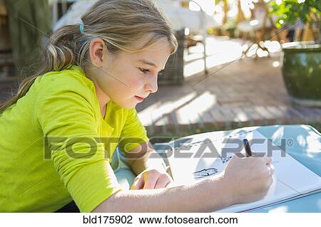 Caucasian girl drawing outdoors View Large Photo Image Stock Image - Caucasian girl drawing outdoors. Fotosearch