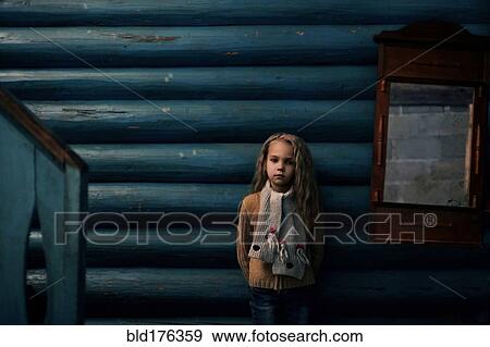 Caucasian girl standing near log cabin View Large Photo Image Stock Photo - Caucasian girl standing near log cabin. Fotosearch