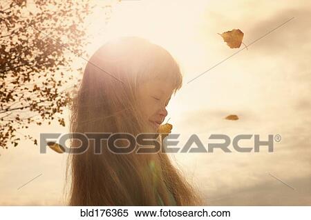 Stock Photography - Caucasian girl standing outdoors. Fotosearch