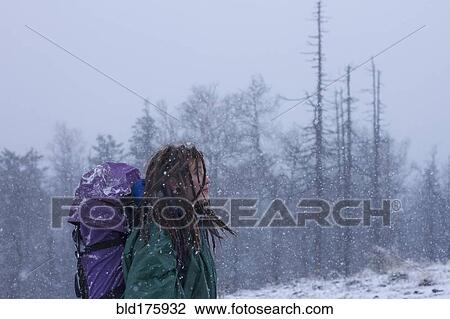 Caucasian hiker walking in snow View Large Photo Image Stock Image - Caucasian hiker walking in snow. Fotosearch