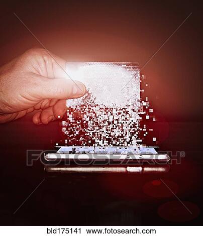 Stock Image - Caucasian man holding pixelated credit card. Fotosearch