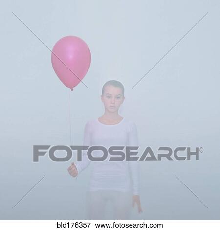 Caucasian teenage girl holding balloon View Large Photo Image Stock Photo - Caucasian teenage girl holding balloon. Fotosearch