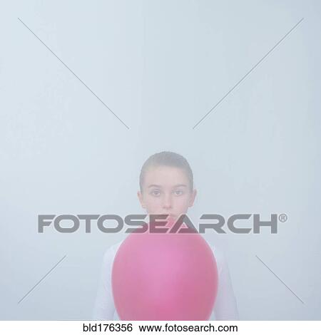 Caucasian teenage girl holding balloon View Large Photo Image Stock Photograph - Caucasian teenage girl holding balloon. Fotosearch