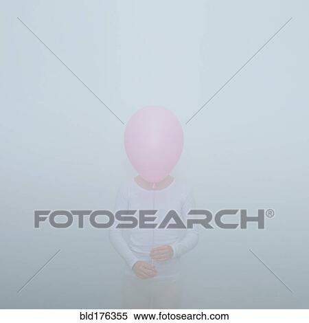 Stock Photography - Caucasian teenage girl holding balloon. Fotosearch