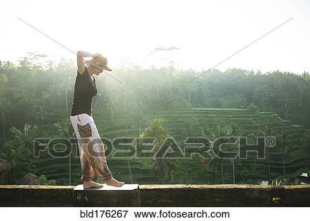 Caucasian tourist over rural rice terrace, Ubud, Bali, Indonesia View Large Photo Image Stock Photo - Caucasian tourist over rural rice terrace, Ubud, Bali, Indonesia. Fotosearch