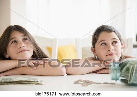 Caucasian twin sisters daydreaming View Large Photo Image Stock Image - Caucasian twin sisters daydreaming. Fotosearch