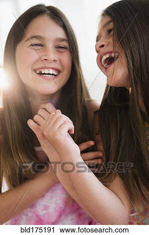 Caucasian twin sisters smiling View Large Photo Image Stock Image - Caucasian twin sisters smiling. Fotosearch
