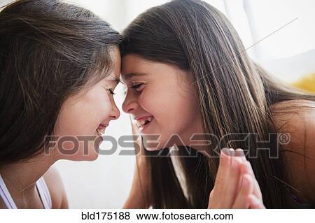Caucasian twin sisters smiling View Large Photo Image Stock Photo - Caucasian twin sisters smiling. Fotosearch