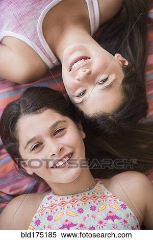 Caucasian twin sisters smiling View Large Photo Image Stock Photography - Caucasian twin sisters smiling. Fotosearch