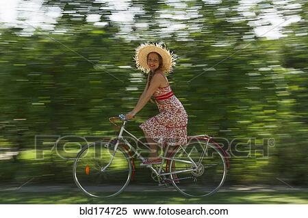 Caucasian woman riding bicycle View Large Photo Image Stock Photography - Caucasian woman riding bicycle. Fotosearch