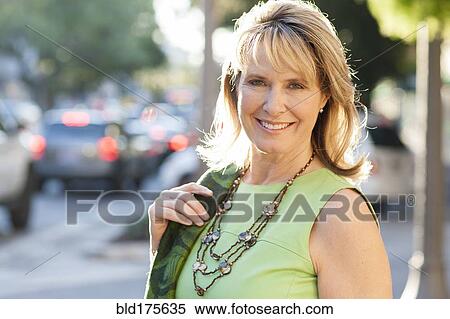 Stock Photography - Caucasian woman smiling in city. Fotosearch