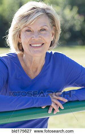 Caucasian woman smiling outdoors View Large Photo Image Stock Photo - Caucasian woman smiling outdoors. Fotosearch