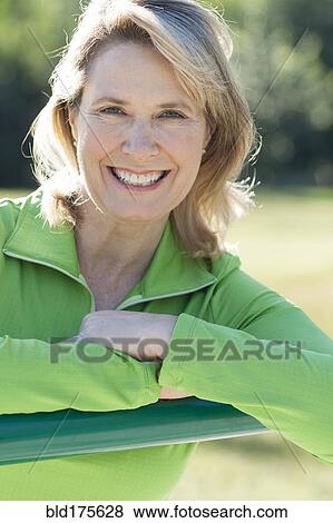 Caucasian woman smiling outdoors View Large Photo Image Stock Photo - Caucasian woman smiling outdoors. Fotosearch