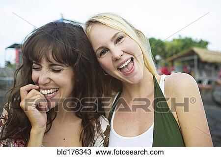 Caucasian women laughing on beach View Large Photo Image Stock Image - Caucasian women laughing on beach. Fotosearch